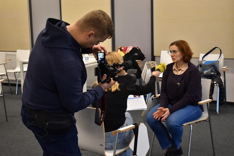 Photo shows 3 people. Photo shows 3 people.