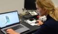 Photo of Ewelina Drelich working on the prosthesis model.